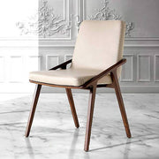 Bézs színű műbőrrel kárpitozott, kőrisfából készült, formatervezett dizájn étkezőszék.