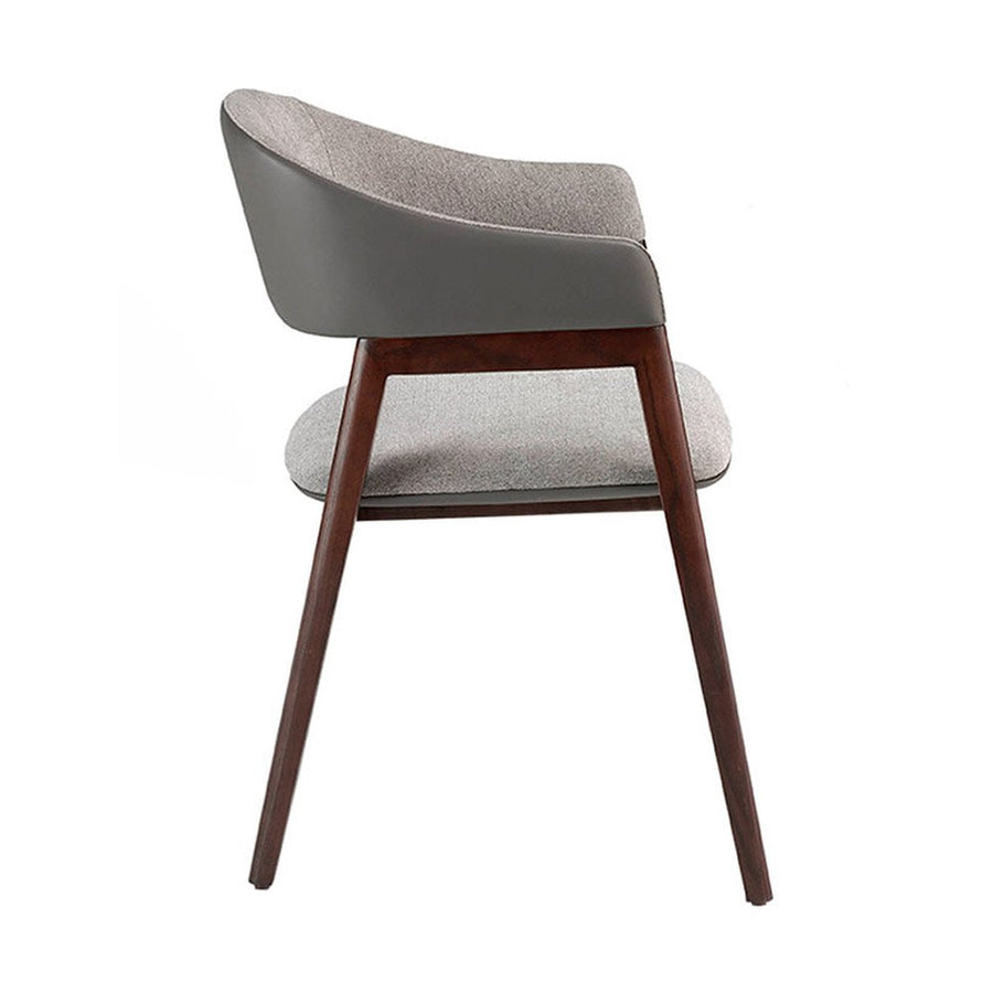 Szürke színű szövettel és műbőrrel kárpitozott, kőrisfából készült, formatervezett dizájn karosszék.