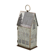 LED világítással rendelkező karácsonyi bádog házikó.