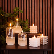 Áttetsző henger formájú, üvegből készült, textilkanócos LED olajlámpa.