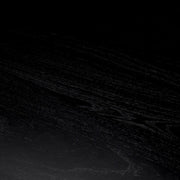 Fekete színű mindifa furnérból készült, formatervezett központi könyvtár asztal.