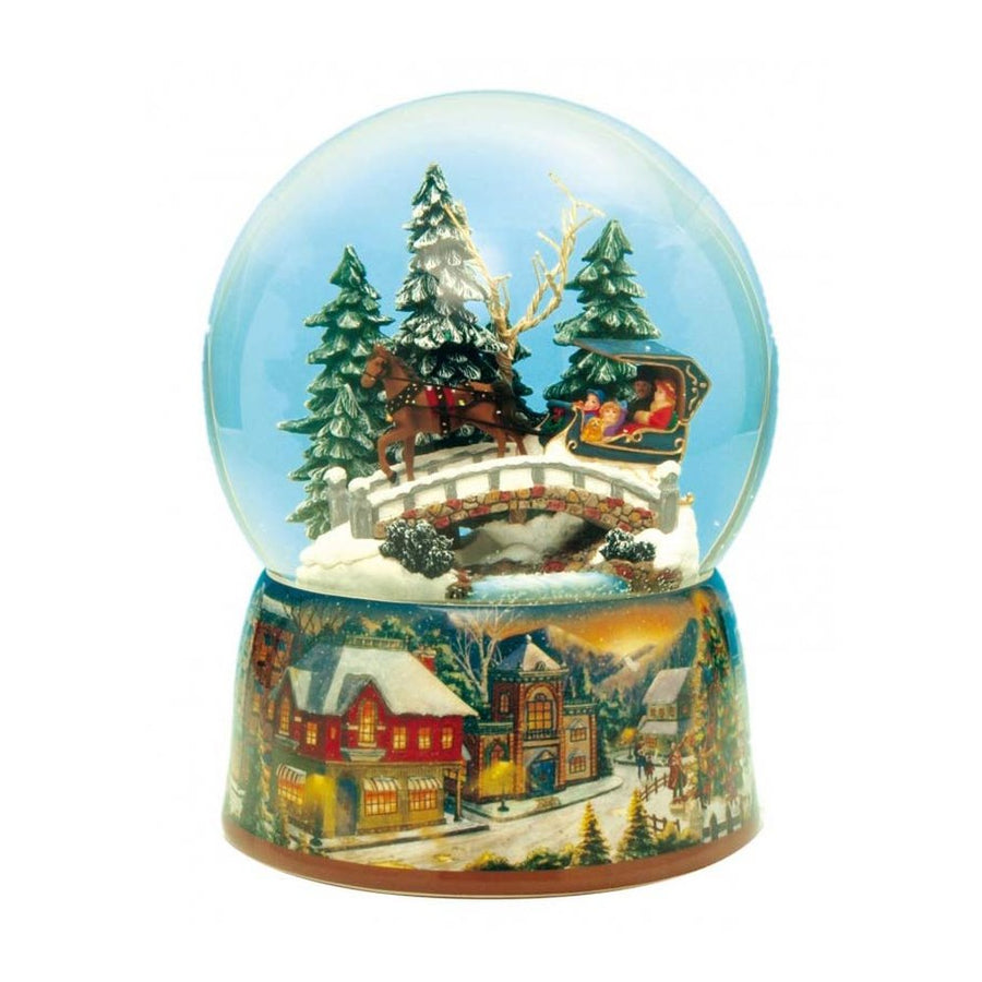 Karácsonyi zenélő hógömb, hídon sikló lovas szánnal.