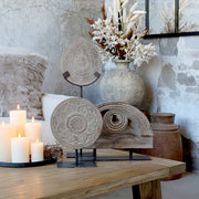 Fém talapzaton álló, antik szürkésbarna színű, kézműves mangófa dísz.