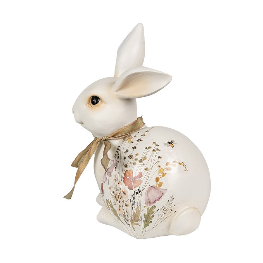 Mezei virágokkal és bézsszínű masnival díszített húsvéti nyuszi figura..