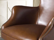 Sötétbarna marhabőrrel kárpitozott, álltató magasságú, forgó bőrfotel.