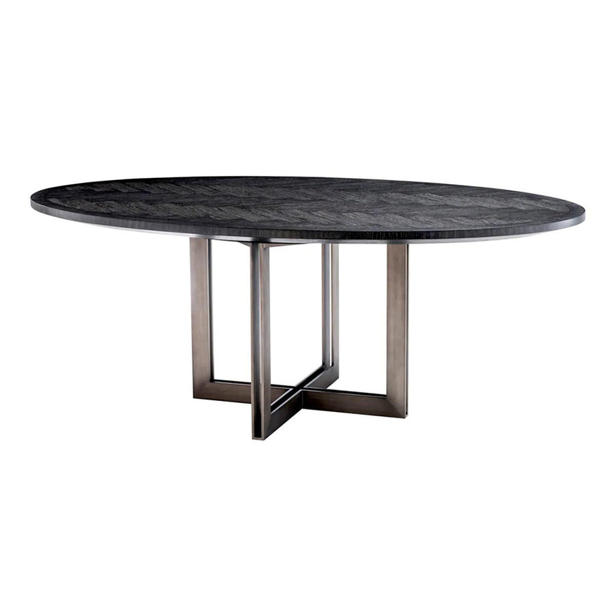 Faszénfekete színű tölgyfurnérból és bronz felületű rozsdamentes acélból készült, ovális formájú design étkezőasztal.