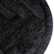 Faszénfekete színű tölgyfurnérból és bronz felületű rozsdamentes acélból készült, ovális formájú design étkezőasztal.