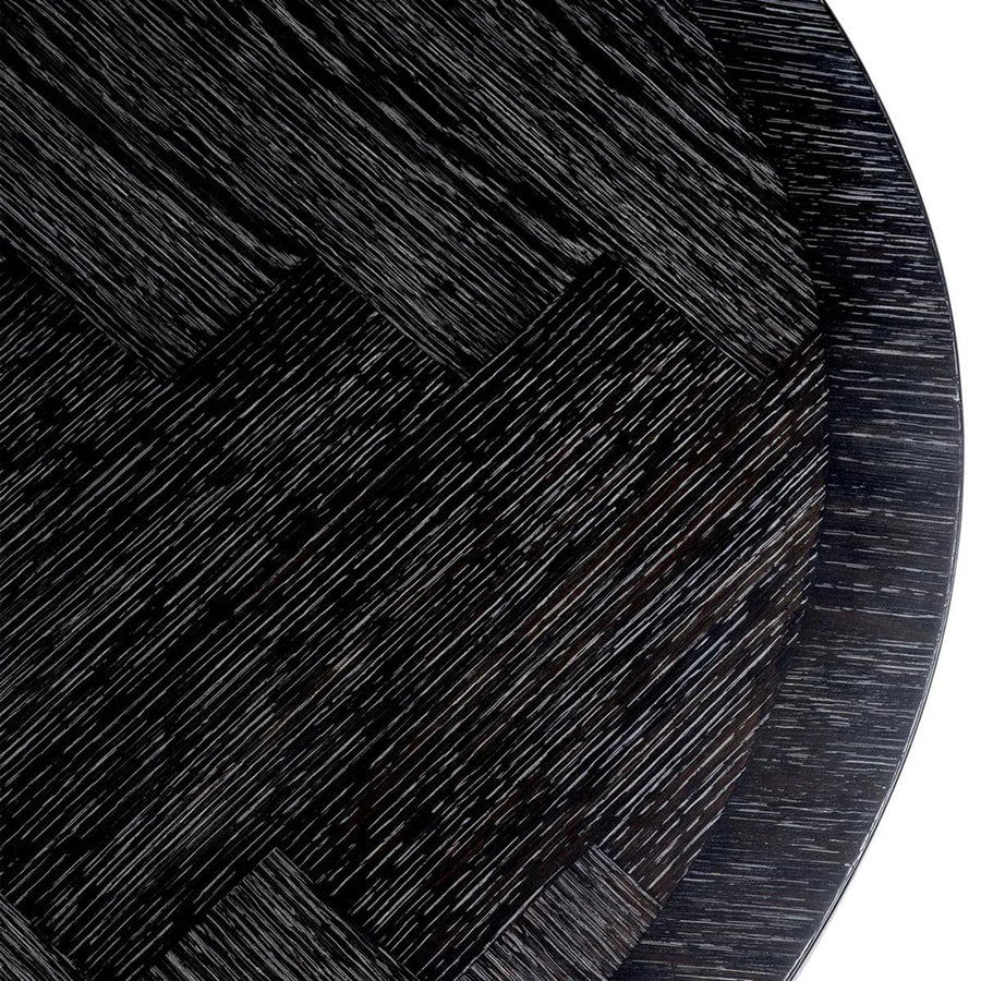 Faszénfekete színű tölgyfurnérból és bronz felületű rozsdamentes acélból készült, ovális formájú design étkezőasztal.