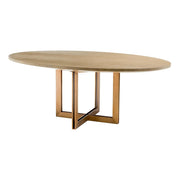 Natúrszínű tölgyfurnérból és sárgaréz felületű rozsdamentes acélból készült, ovális formájú design étkezőasztal.