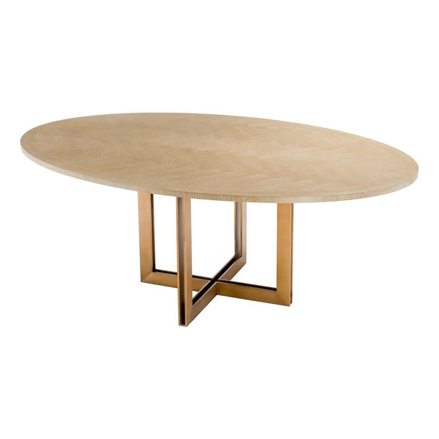 Natúrszínű tölgyfurnérból és sárgaréz felületű rozsdamentes acélból készült, ovális formájú design étkezőasztal.