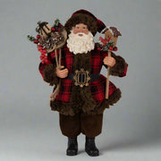 Ajándékot hozó, bordó színű Mikulás figura.