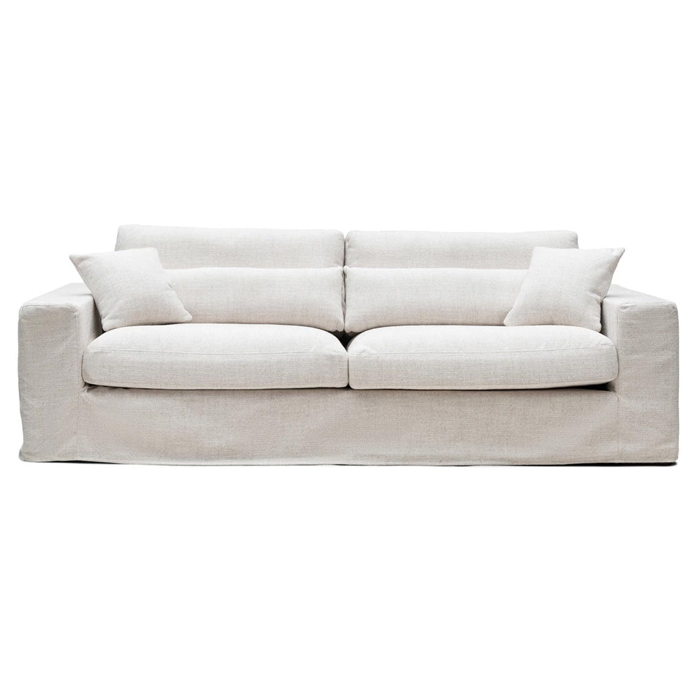 Törtfehér színvilágú, elegáns, 'loose cover' huzatos kialakítású, 3-4 személyes, kortárs design kanapé.