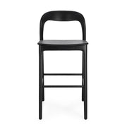 Fekete színű, teakfából ;készült, formatervezett bárszék.