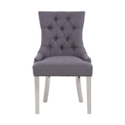 Ezüstszínű, rozsdamentes acéllábbakon álló, szürke színű poliészter vászonnal kárpitozott dizájn étkezőszék.