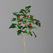Piros bogyós karácsonyi mű magyal ág.