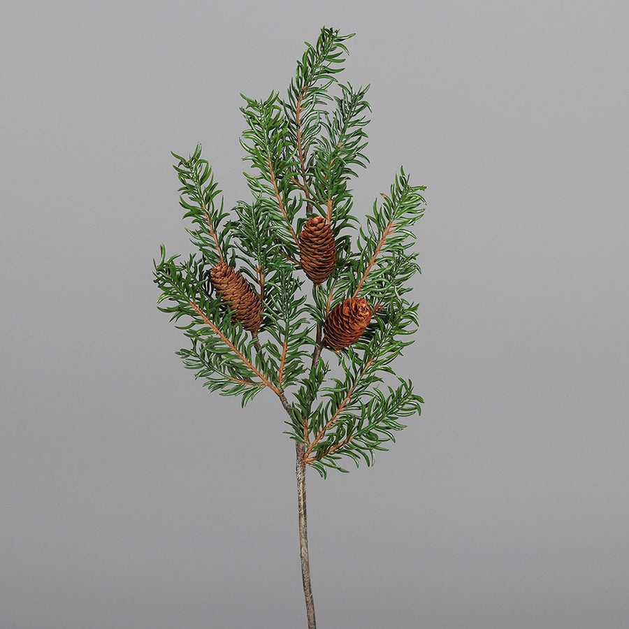 Tobozokkal díszített, zöld színű mű nobilis fenyő ág.