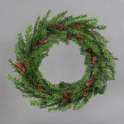 Mesterséges nobilis fenyőágakból készült, tobozokkal díszített ajtódísz koszorú.