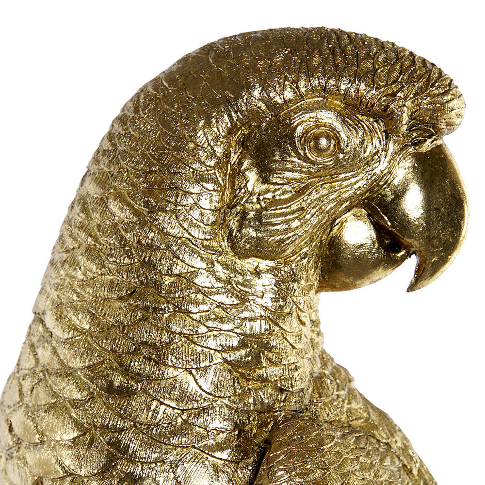 Aranyszínű, dekoratív papagáj figura.