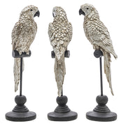 Ezüstszínű, dekoratív papagáj figura.