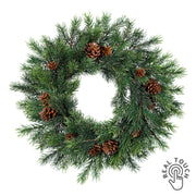 Sötétzöld színű, mű lucfenyő koszorú.