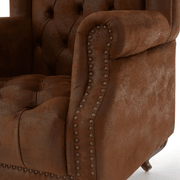 Rozsdabarna színű műbőrrel kárpitozott, trónszerű statement fotel.