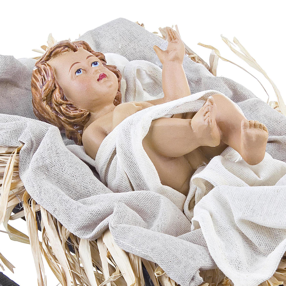 Sacred kis Jézus figura jászolban fehér textíliák és szalma között