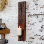 Újrahasznosított, régi fából készült, kézműves fali gyertyatartó.