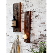 Újrahasznosított, régi fából készült, kézműves fali gyertyatartó.