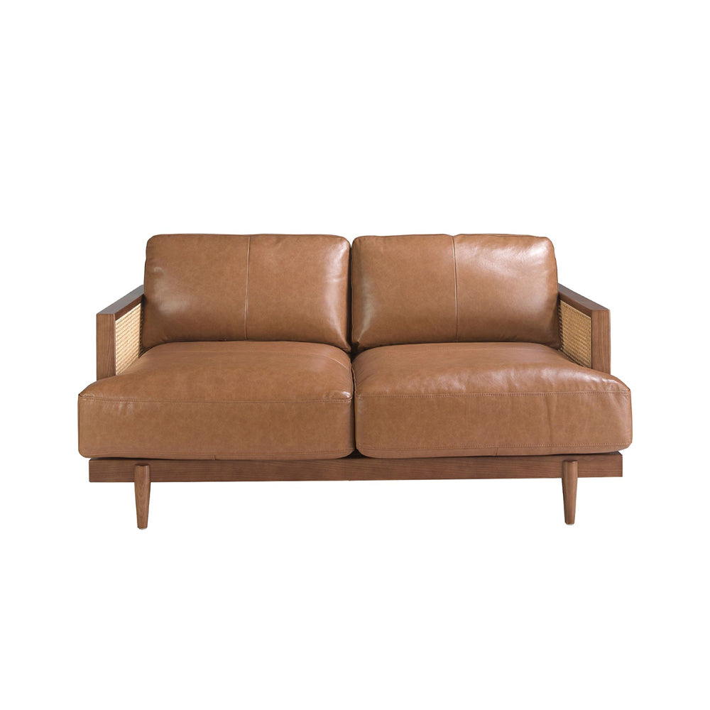 Barna színű marhabőrrel kárpitozott, rattanbetétes, 2 személyes design kanapé.
