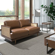 Barna színű marhabőrrel kárpitozott, rattanbetétes, 2 személyes design kanapé.