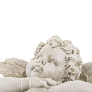 Kőhatású puttó figura.