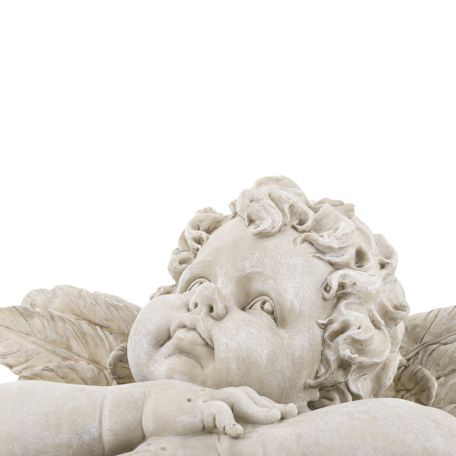 Kőhatású puttó figura.