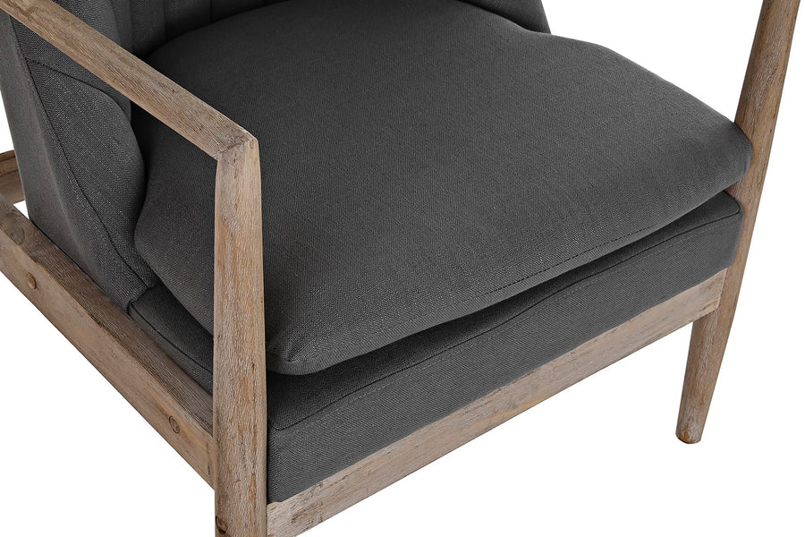 Szürke színű szövettel kárpitozott, formaterveztt karfás fotel.