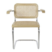 Modern fémvázas, natúr színű, rattan betétes karosszék.