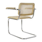 Modern fémvázas, natúr színű, rattan betétes karosszék.