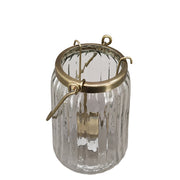 Bordázott üvegből és aranyszínű alumíniumból készült mécsestartó.