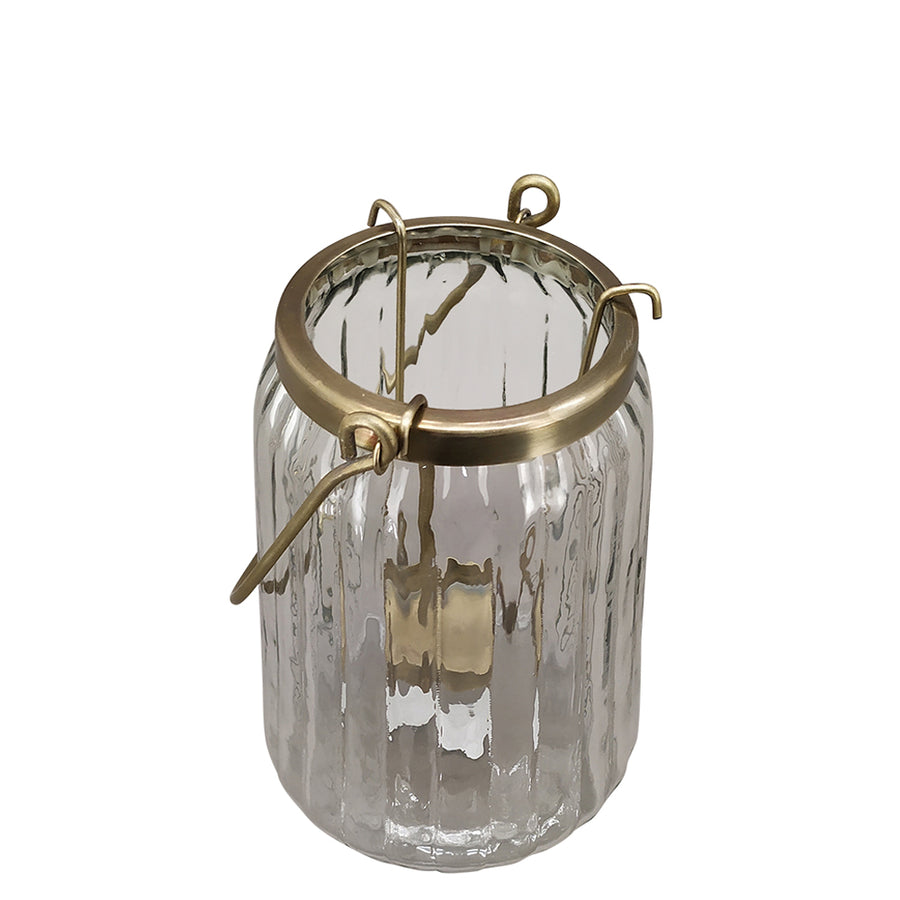 Bordázott üvegből és aranyszínű alumíniumból készült mécsestartó.