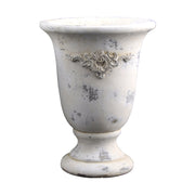 Krémszínű, antikolt felületű, magas cement kaspó növényi motívum díszítéssel, a VALO kollekcióból.