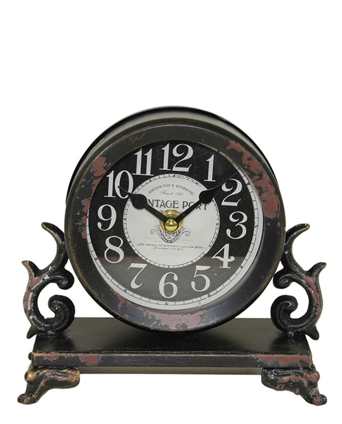 Antikolt felületű fém asztali óra.
