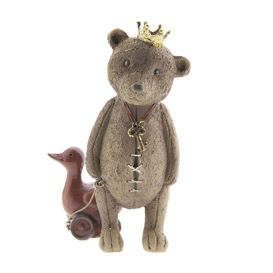 Játék libát húzó, koronát viselő nosztalgikus maci figura.