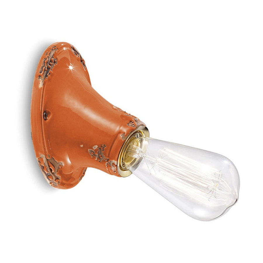 Antikolt felületű mázas kerámiából készült kézműves falilámpa.