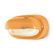 Antikolt felületű mázas kerámiából és bordázott üvegből készült kézműves falilámpa.