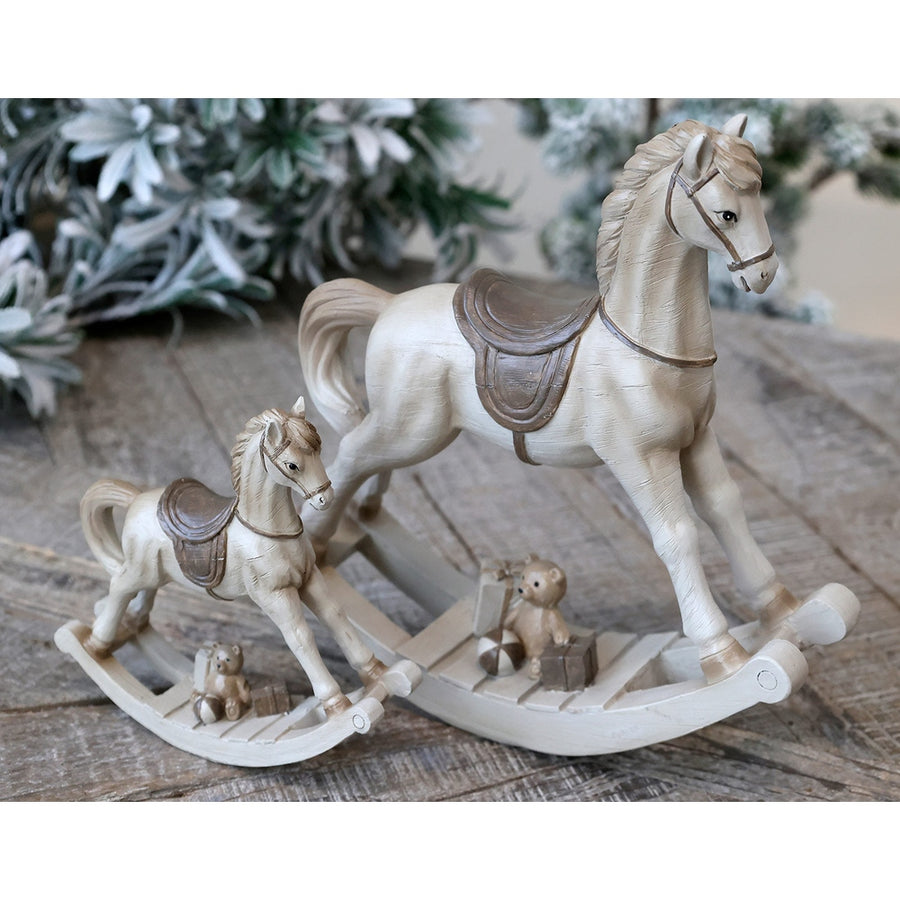 Krémszínű karácsonyi dekorációs hintaló.