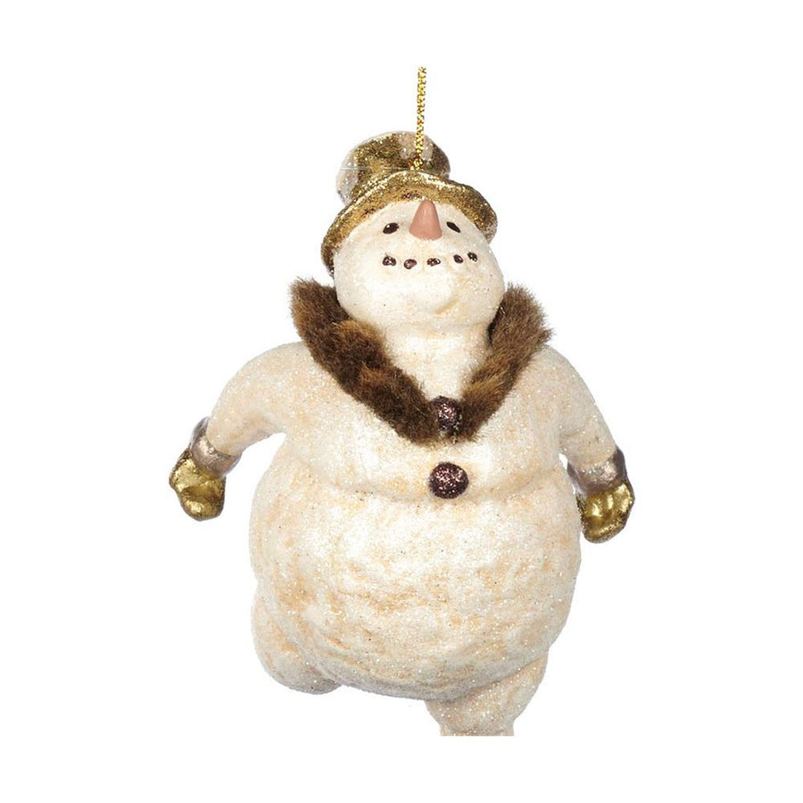 Aranyszínű kesztyűt és cilindert viselő, krémszínű hóember formájú karácsonyfadísz.