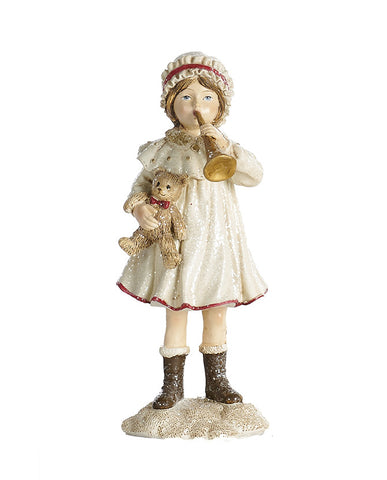 Ünnepi harsonát és mackót tartó, krémszínű karácsonyi kislány.