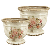 Két rózsamintás kerámia kaspó egymás mellett – talpas, vintage stílusú kaspók különböző méretben, beltéri vagy fedett kültéri használatra