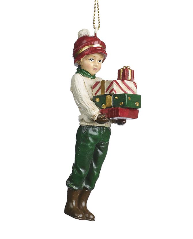 Ajándékokat tartó, piros és zöld színárnyalatú téli kisfiú formájú karácsonyfadísz.