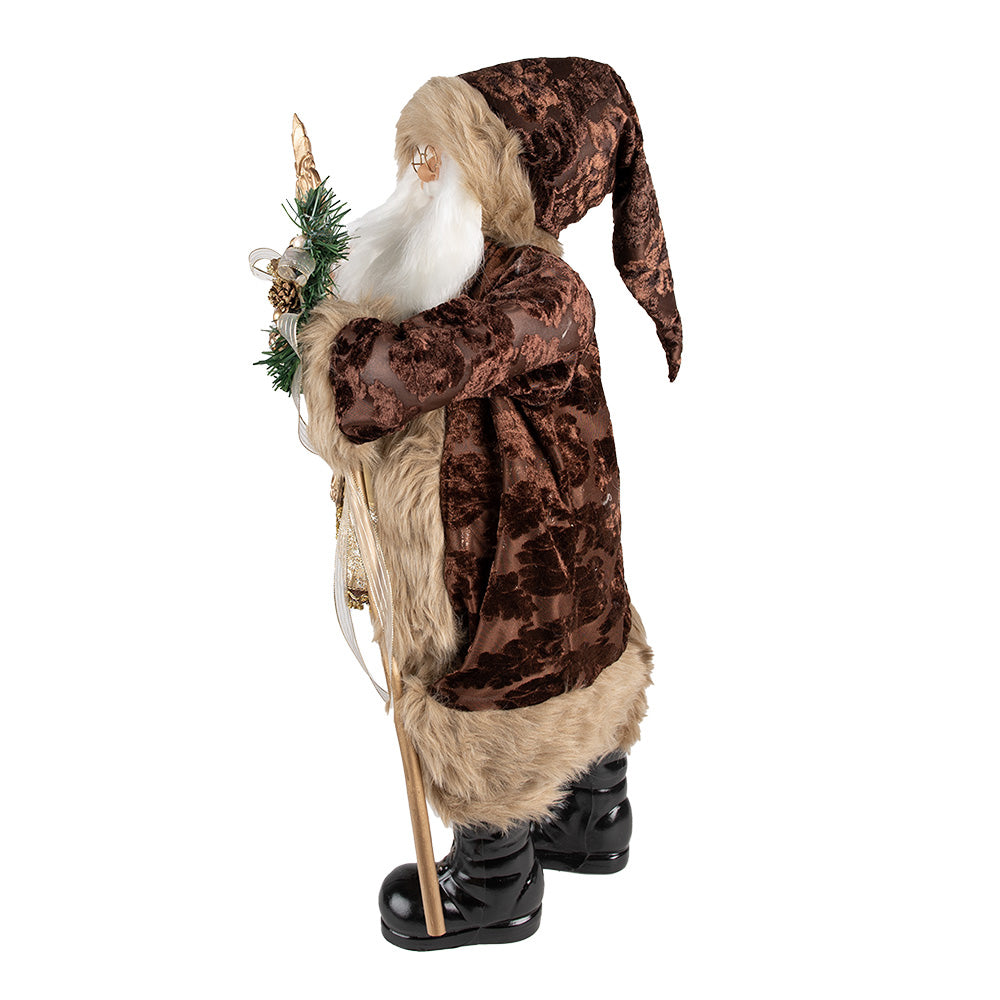 Barna és pezsgőszínű öltözetet viselő, dekoratív Télapó figura.
