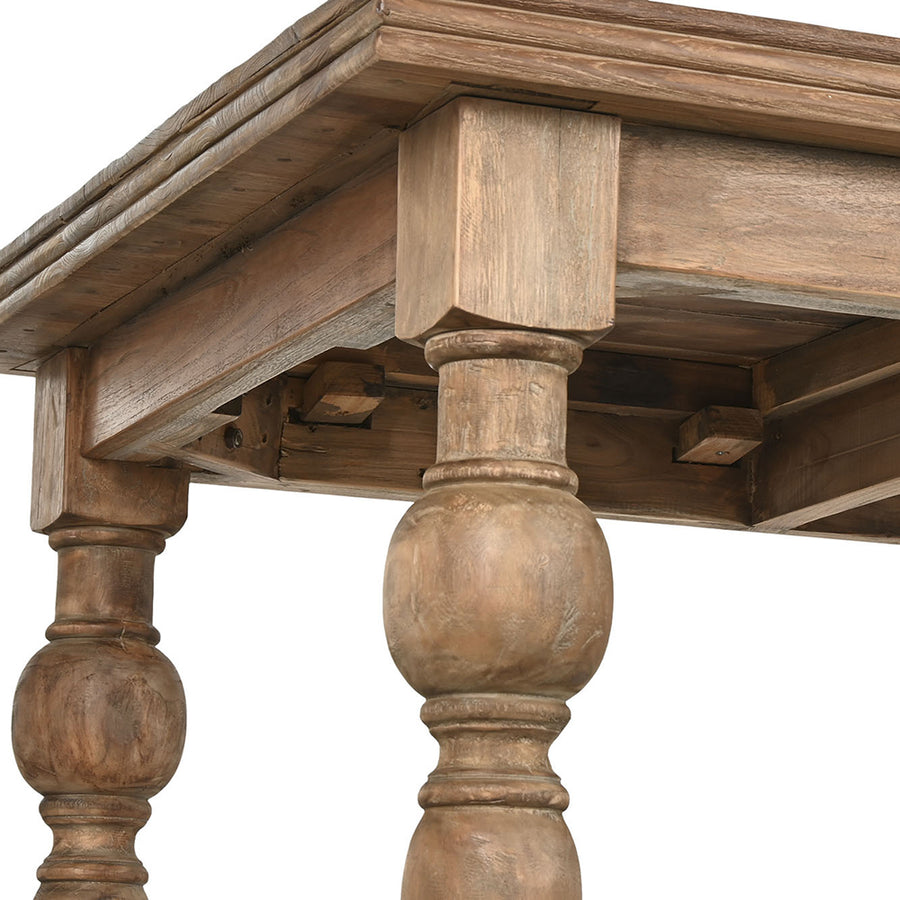 Natúr színű, díszes lábú teakfa étkezőasztal.