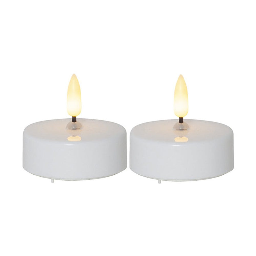 2 darabos, fehér színű műanyag testtel rendelkező, időzítővel ellátott 5,8 cm átmérőjű LED teamécses meleg fehér fényű, realisztikus LED lánggal.